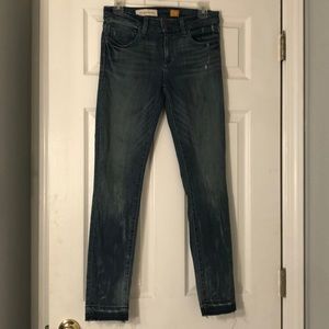 Distressed blue jeans from Anthropologie. Size 27.